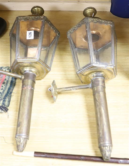 A pair of copper and brass coaching lamps